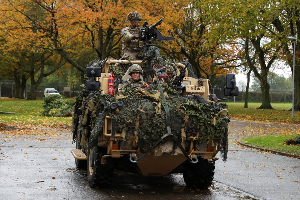 Princess Kate drives an armoured vehicle at the Robertson Barracks in Norfolk