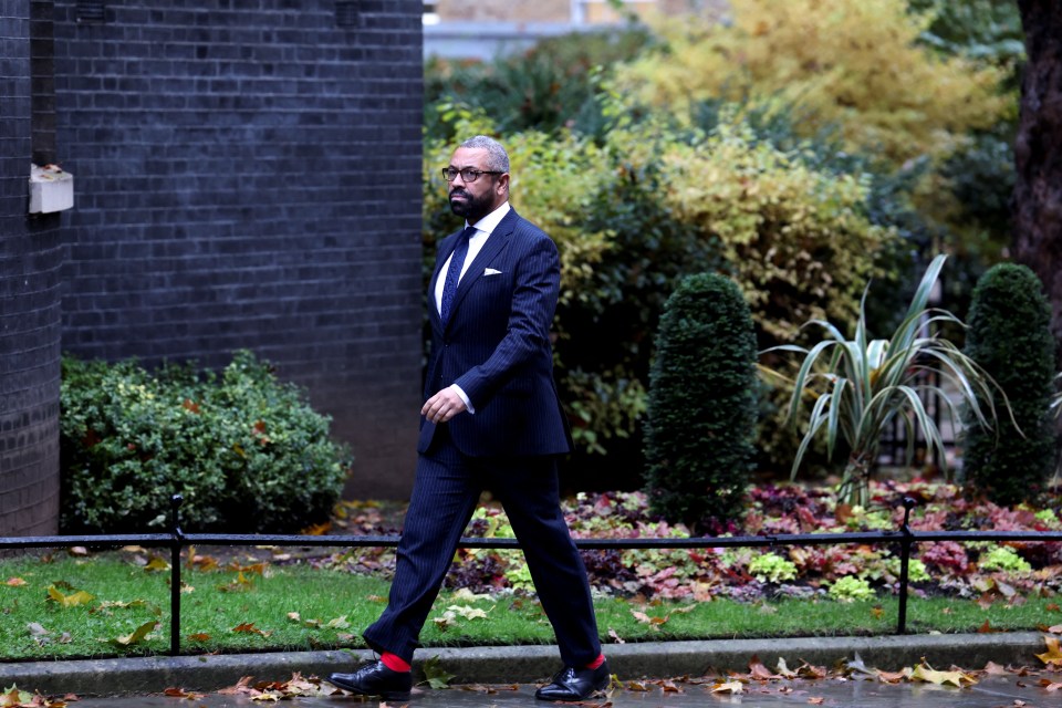 Britain’s Home Secretary James Cleverly walks at 10 Downing Street in London