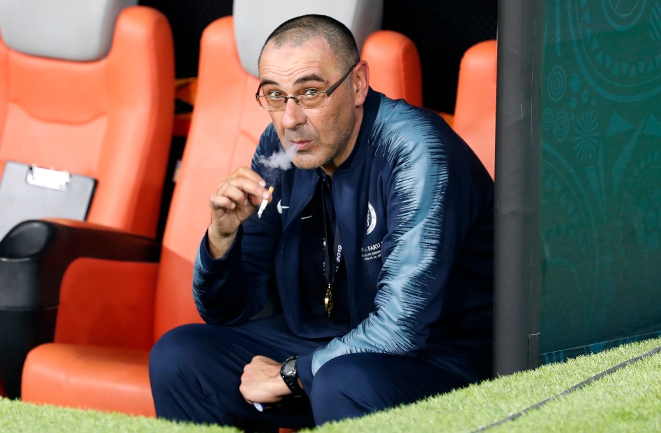 Sarri, 64, puffs on a cigarette after winning the Europa League in 2019