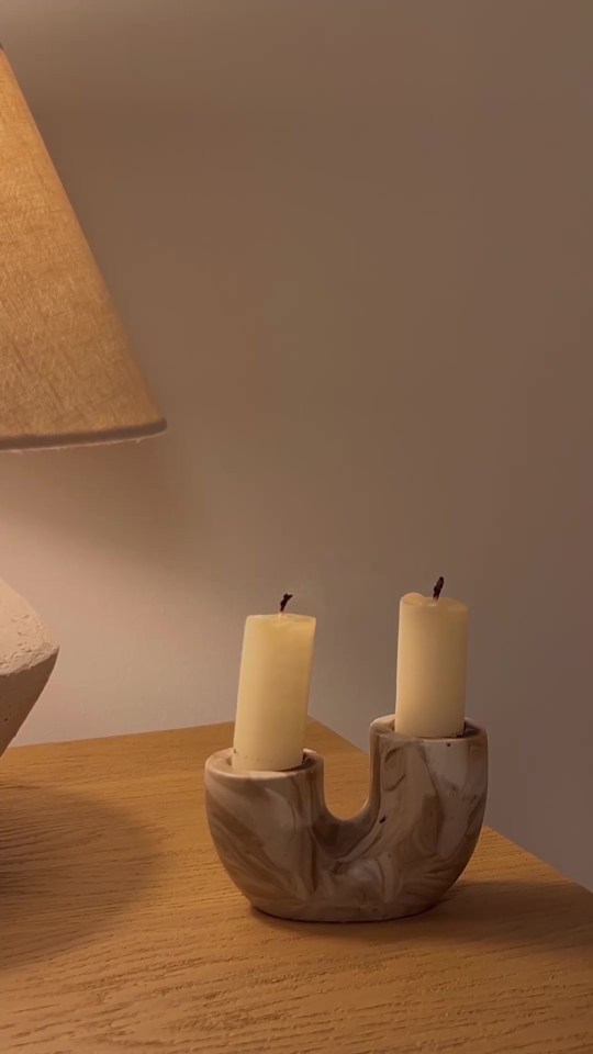 A quirky wooden candle holder featured in the video