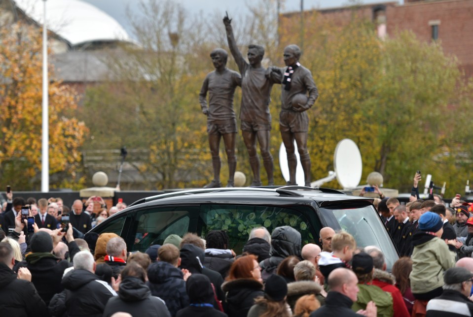 The funeral cortege making its way to Manchester Cathedral via Old Trafford