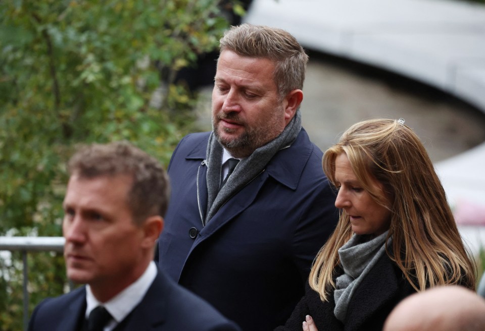 United chief executive Richard Arnold pictured walking to the funeral service