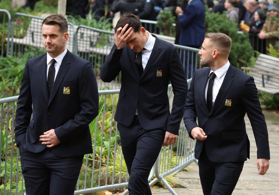 Tom Heaton (left) Harry Maguire (centre) and Luke Shaw (right) were among United's current players in attendance