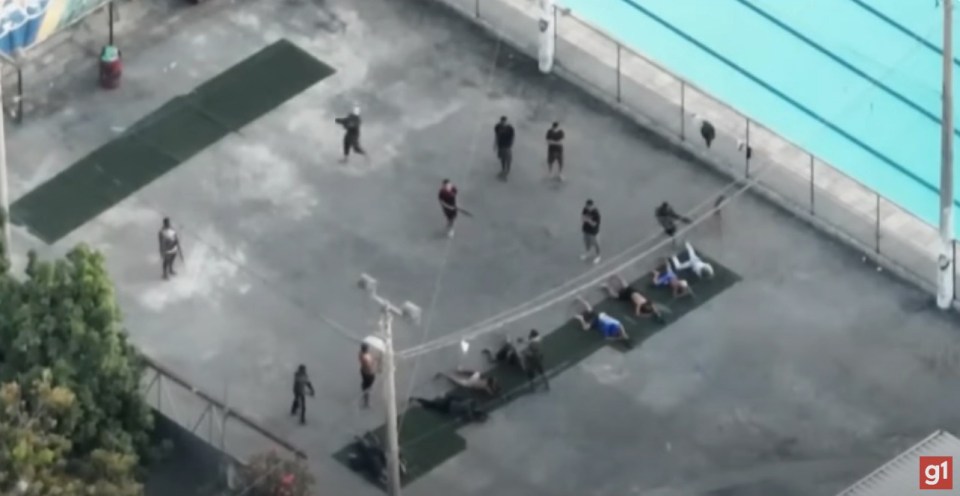 Drug traffickers and their minions took over a public football court to train with heavy weapons