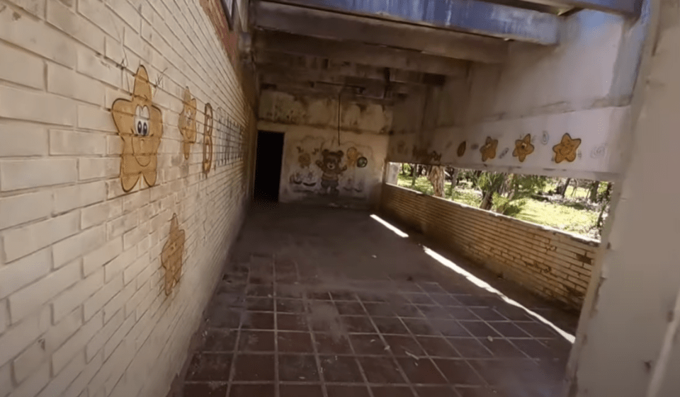 Footage taken from inside the hotel shows a dilapidated kid's play area