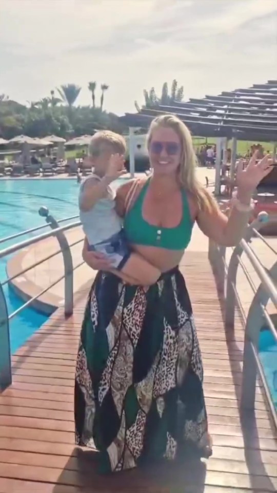 Josie posed with son Reggie by the pool