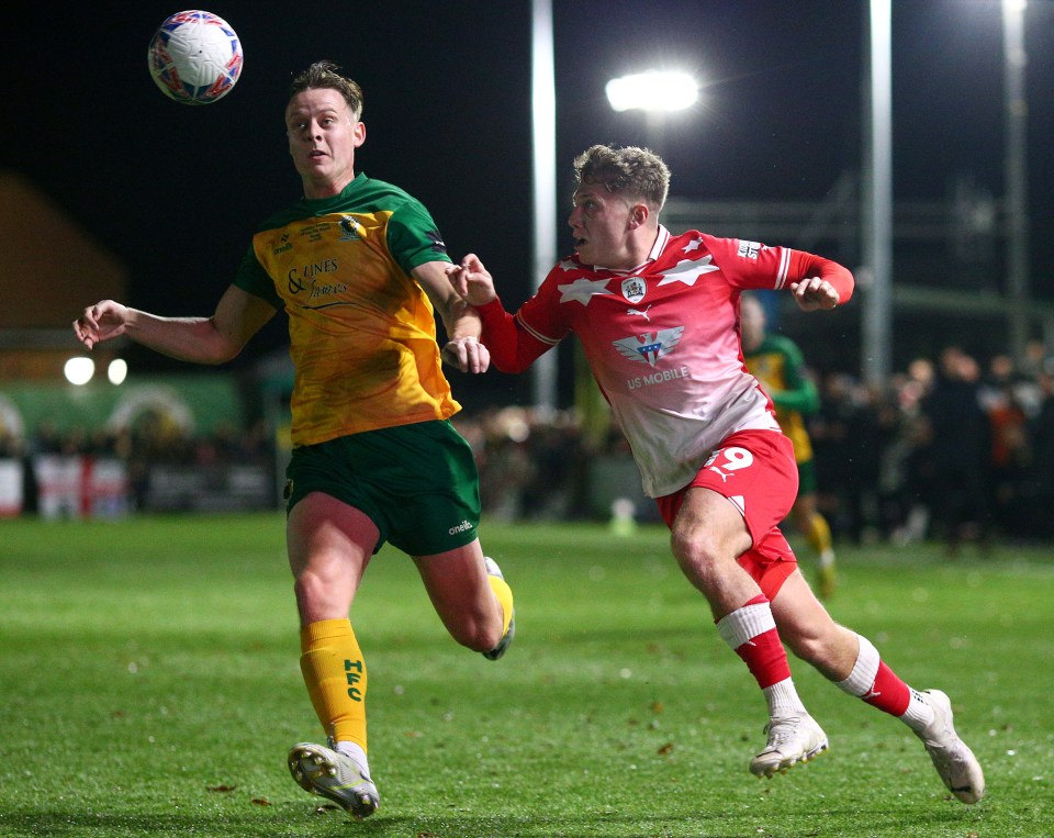 Rules were broken as Aiden Marsh (right) played in the replay between Barnsley and Horsham