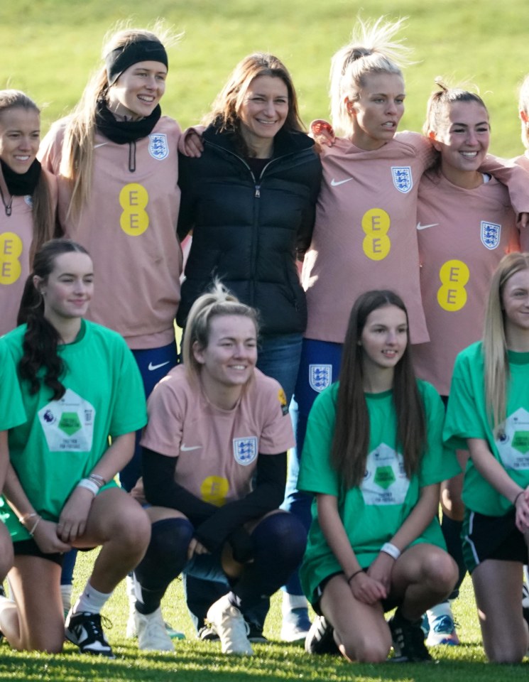 Culture Secretary Lucy Frazer on the pitch with the Lionesses and a local girls' football club