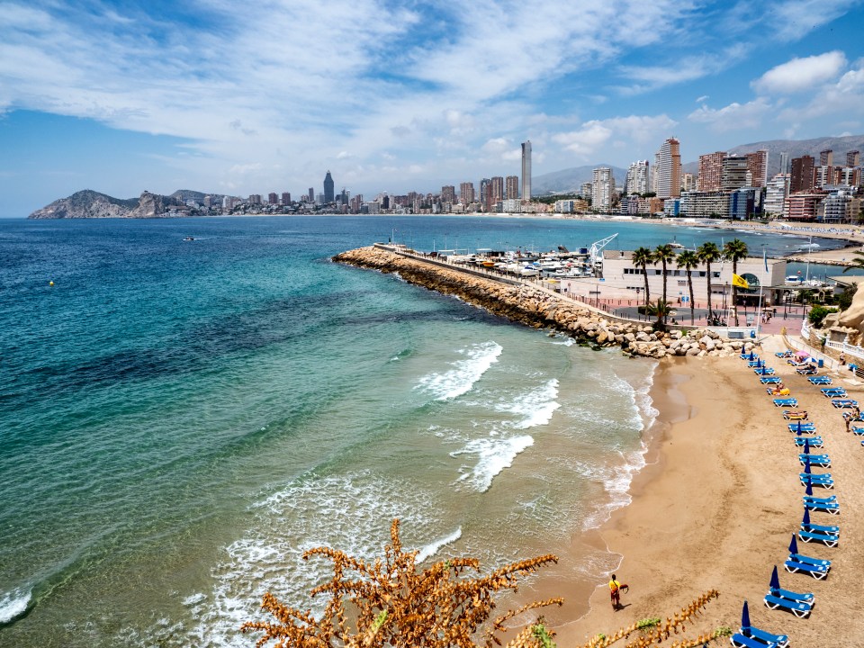 Benidorm has holiday packages from £242pp, pints from 87p and endless miles of sandy beaches