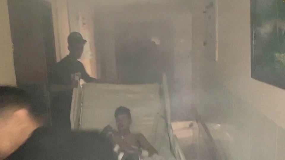 Smokey footage inside the hospital appears to show patients being moved away from the fighting