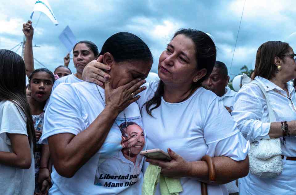 Cilenis Marulanda (left), the mother of Liverpool’s Luis Diaz, demonstrates for her kidnapped husband in Barrancas, Colombia