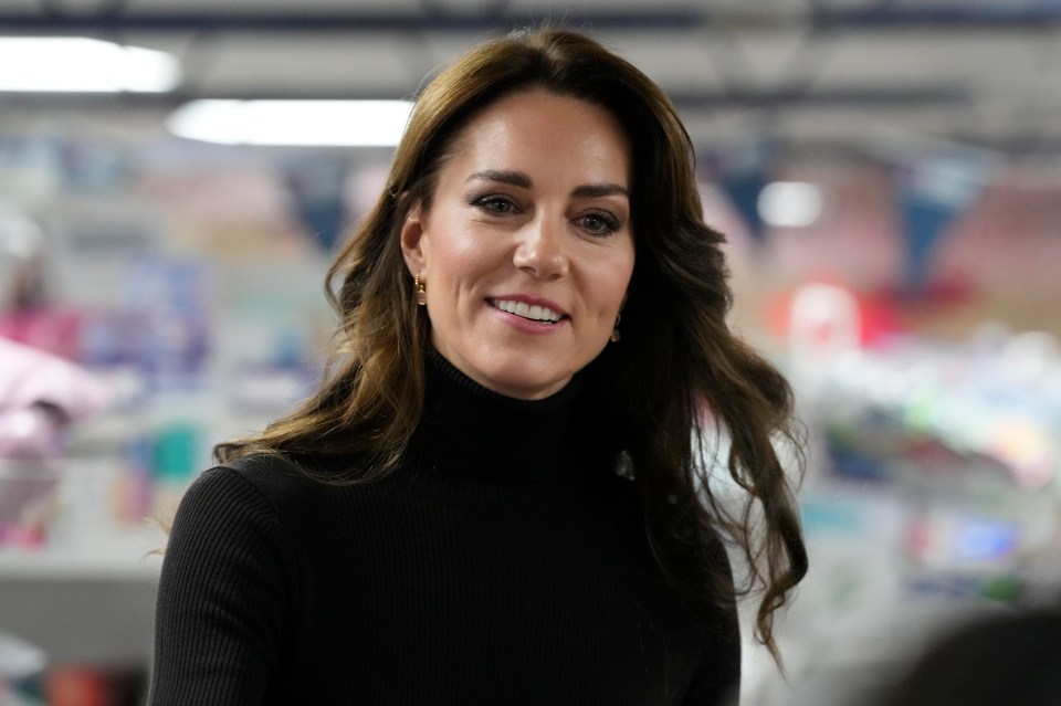 Princess Kate, pictured working on Friday, has been on the receiving end of a swipe from Harry and Meghan's biographer Omid Scobie