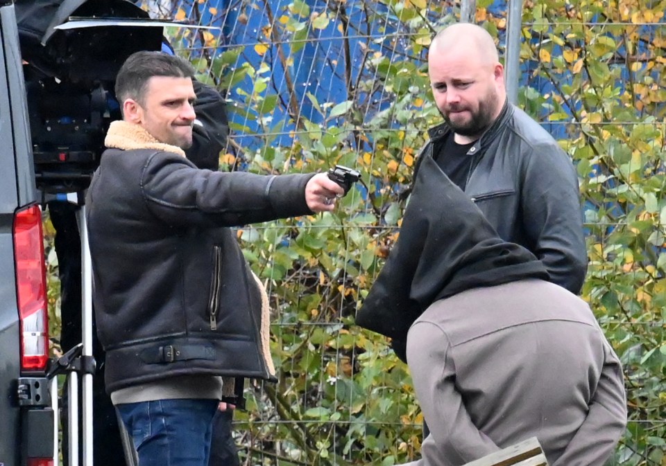 Damon holds Adam at gunpoint upon his soap return