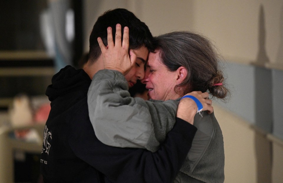 Hostage Sharon Avigdori hugs her son Omer after being released on Saturday