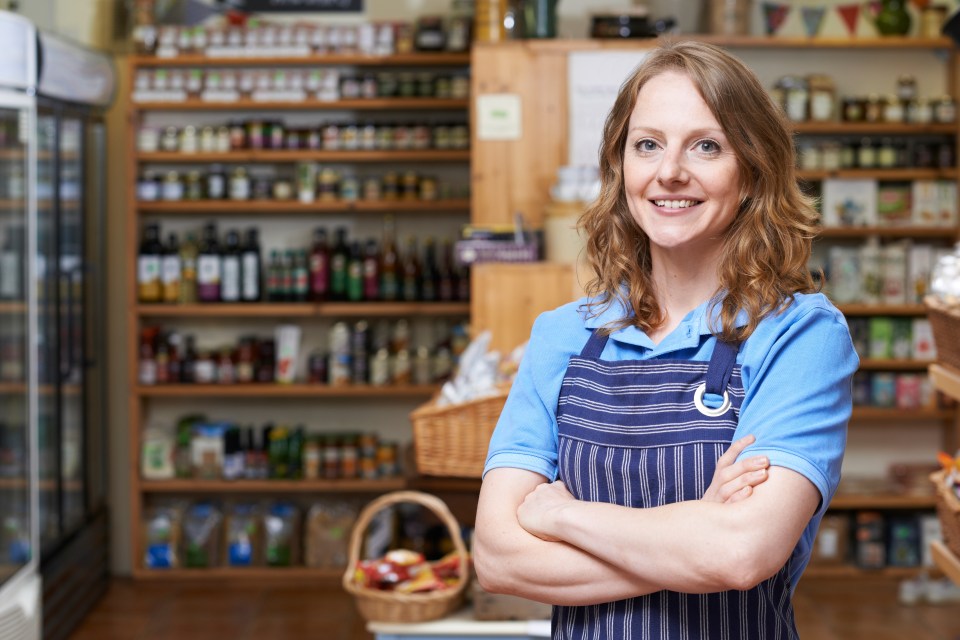 Portrait Of Woman Working In Delicatessen; Shutterstock ID 479829667; purchase_order: -; job: -; client: -; other: -