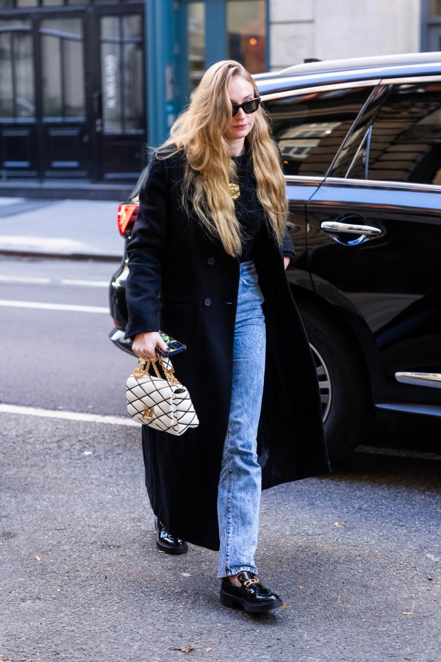 She accessorised with a white handbag and sunglasses