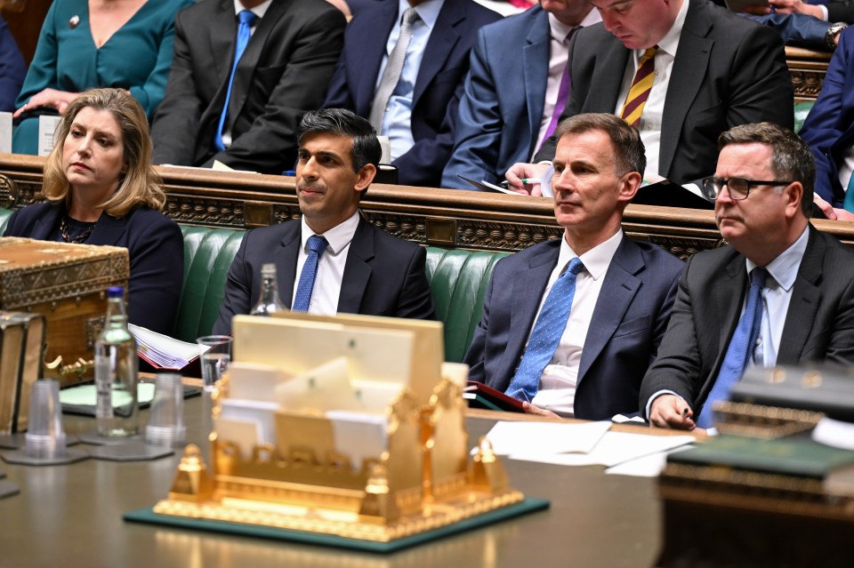 Leader of the House of Commons Penny Mordaunt, Prime Minister Rishi Sunak, Chancellor of the Exchequer Jeremy Hunt take a seat following the delivery of the Autumn Statement