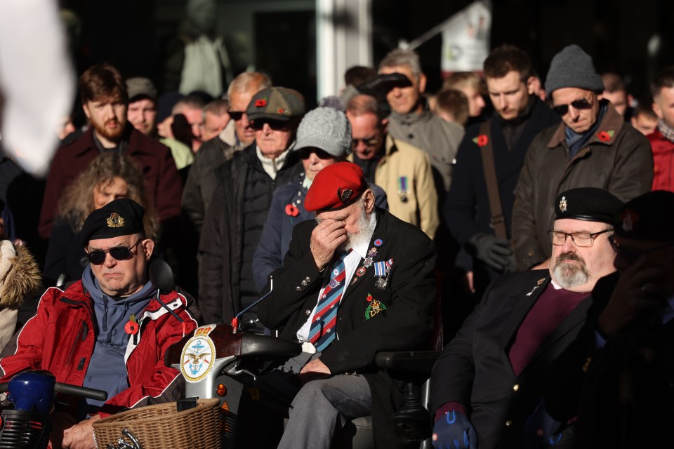 A veteran bowed his head as he remembered fellow fallen service men and women