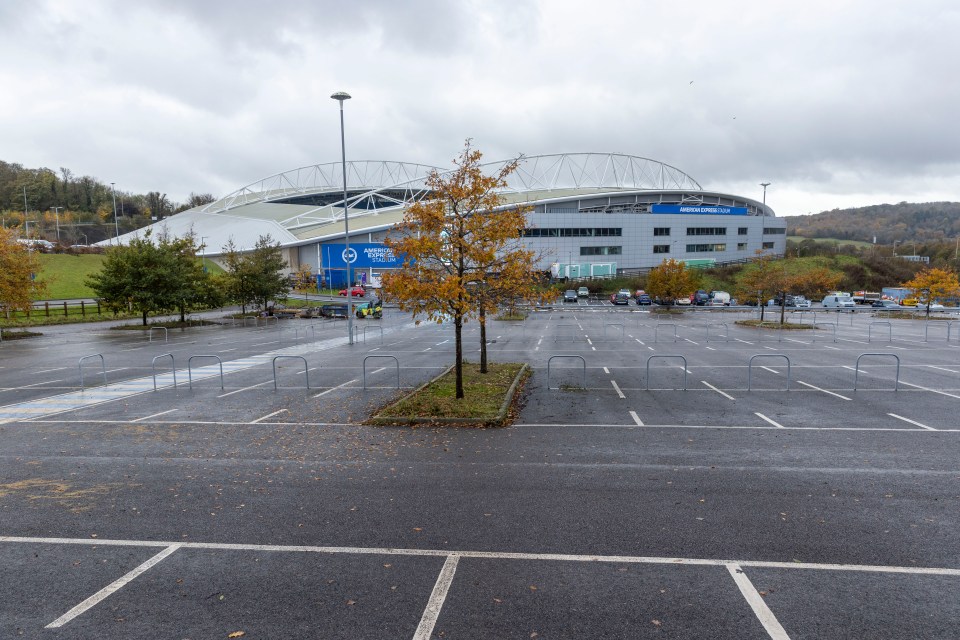 The car next to the stadium is no longer in use