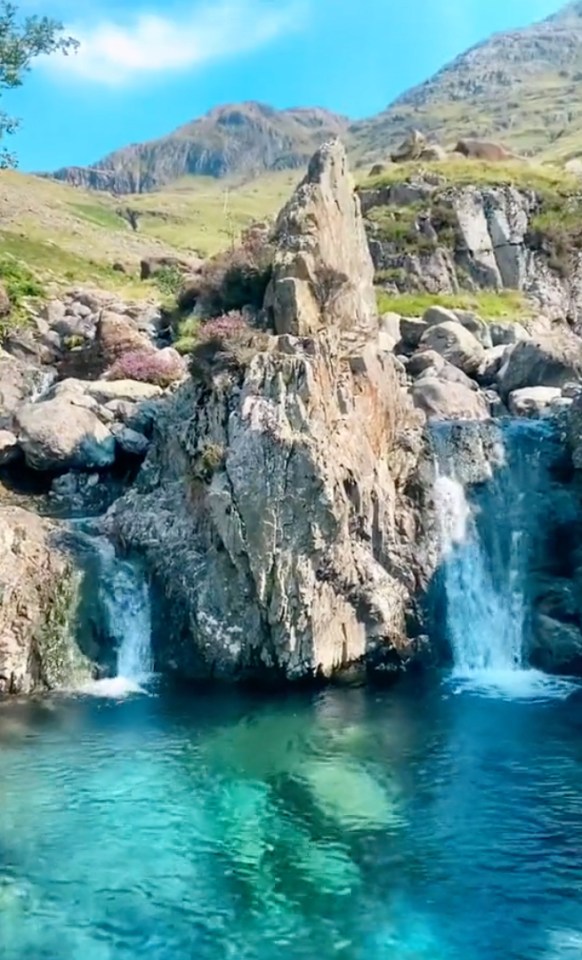 The waters at the emerald fairy pool are turquoise and clear