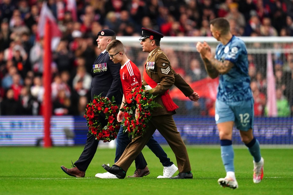 The teenage supporter walked off with the military personnel