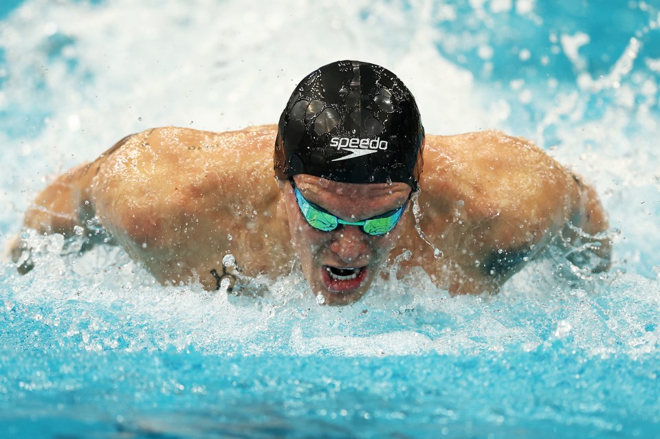 The singer-turned-popstar won the 100m butterfly at the Queensland Swimming Championships