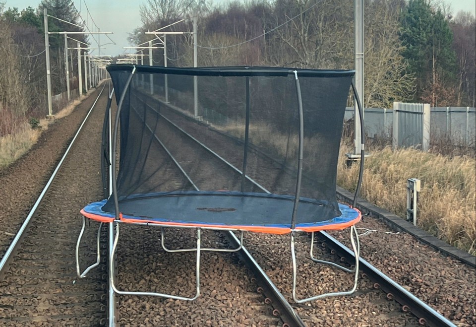 Storm Pia blew a trampoline onto the tracks on the main line between Glasgow and Edinburgh yesterday