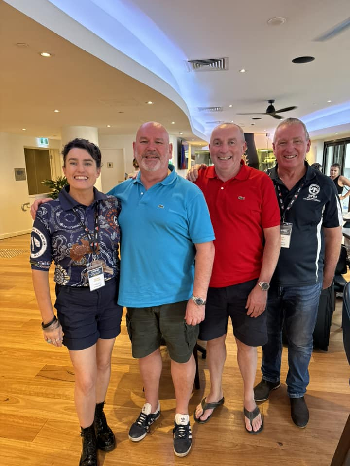 Mick Whelan has avoided Britain's rail crisis by jetting off to Australia. He is pictured with three delegates at a union event