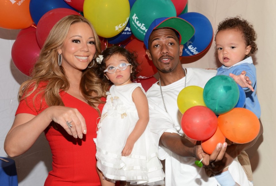 SANTA MONICA, CA - OCTOBER 06: Recording artist Mariah Carey, her husband Nick Cannon and their twins Monroe Cannon (L) and Moroccan Cannon attend "Family Day" hosted by Nick Cannon at Santa Monica Pier on October 6, 2012 in Santa Monica, California. (Photo by Amanda Edwards/Getty Images)