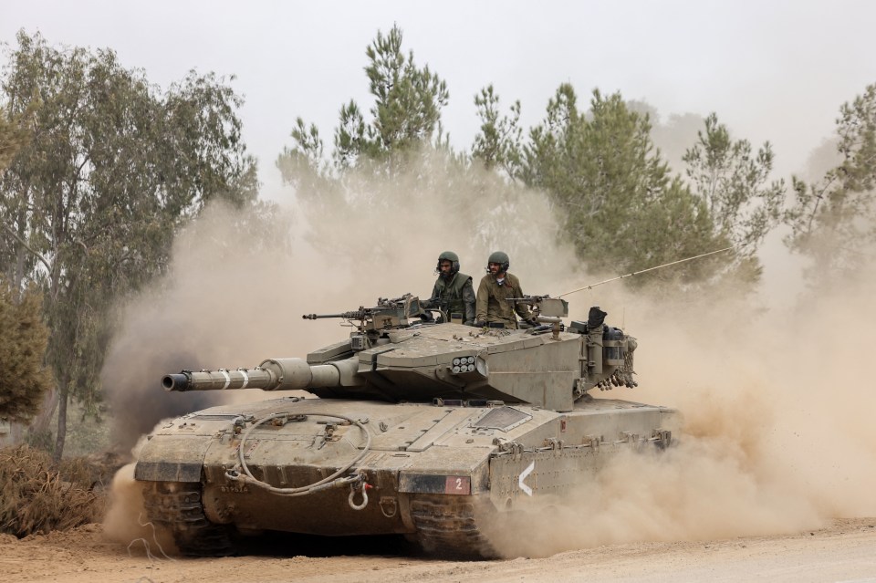 Israeli tanks rolling near the border with Gaza as the ground offensive widens