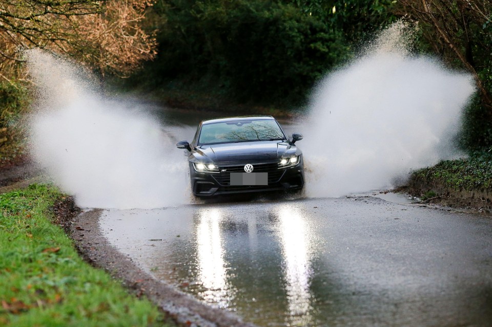 It was wet on the roads in Godalming, Surrey too