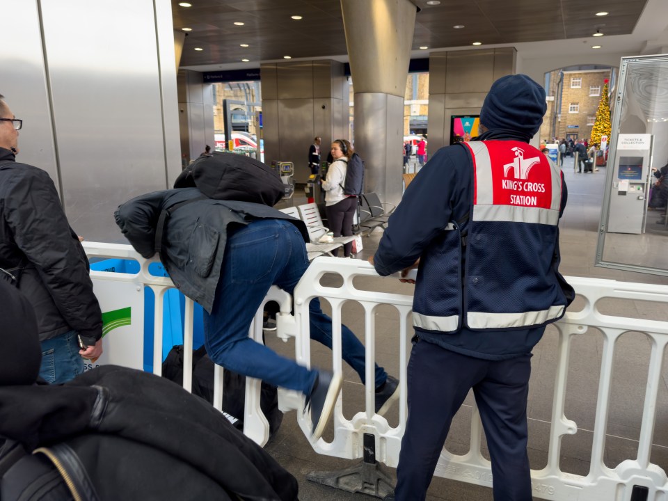 A passenger vaulting a barrier at the station