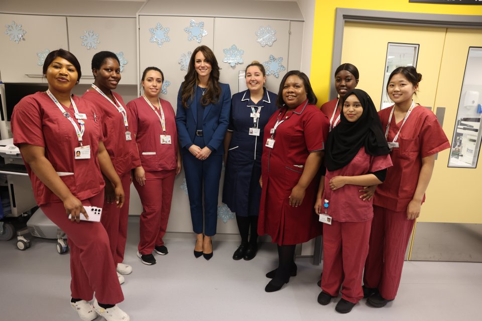 The Princess looked proud to pose with the dedicated and hard working staff