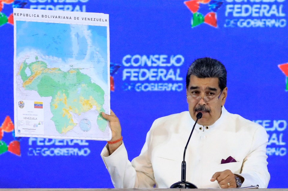 Nicolas Maduro holding up a map of the region showing Guyana Essequibo under Venezuelan control