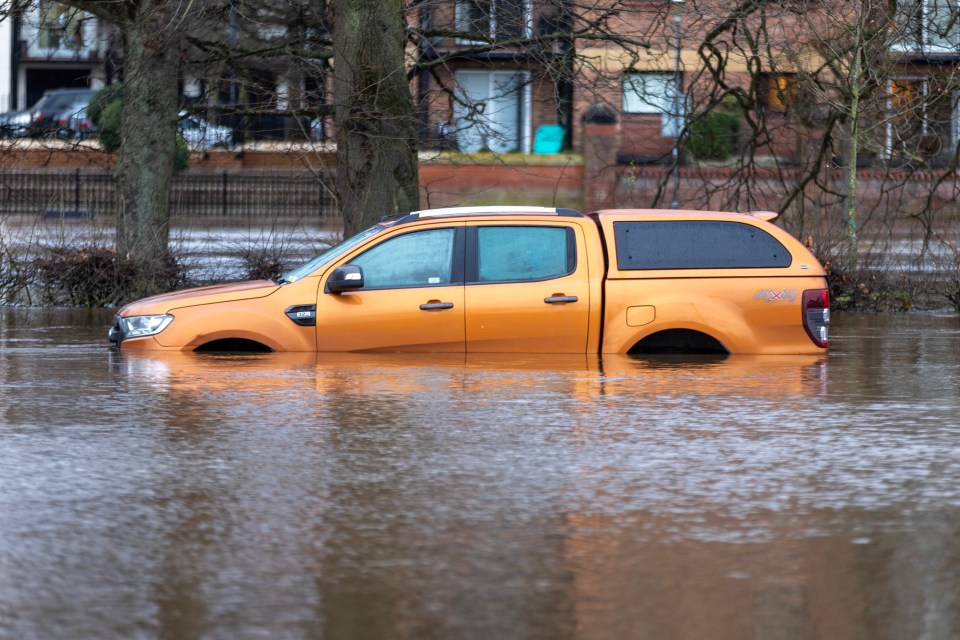 Cars have been abandoned in floodwater rising to over four metres in York City Centre