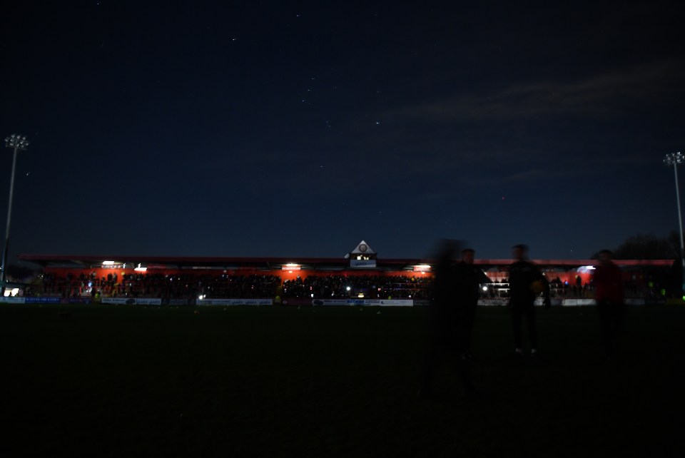 The stadium was almost entirely in darkness