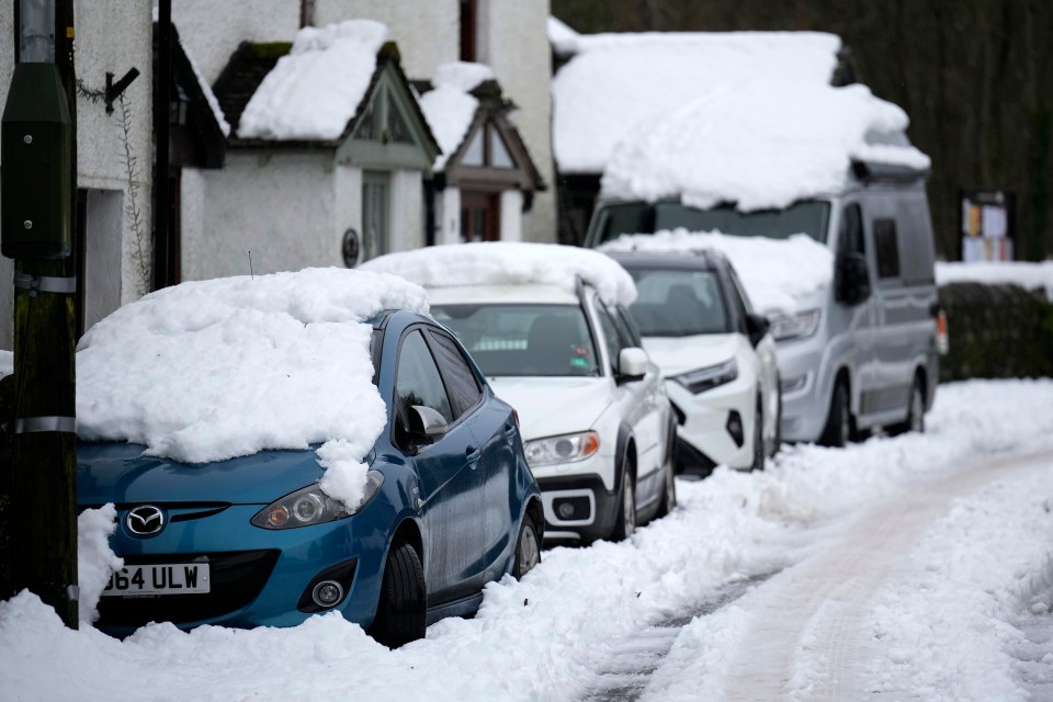 Snow-covered cars in Ings, Cumbria yesterday