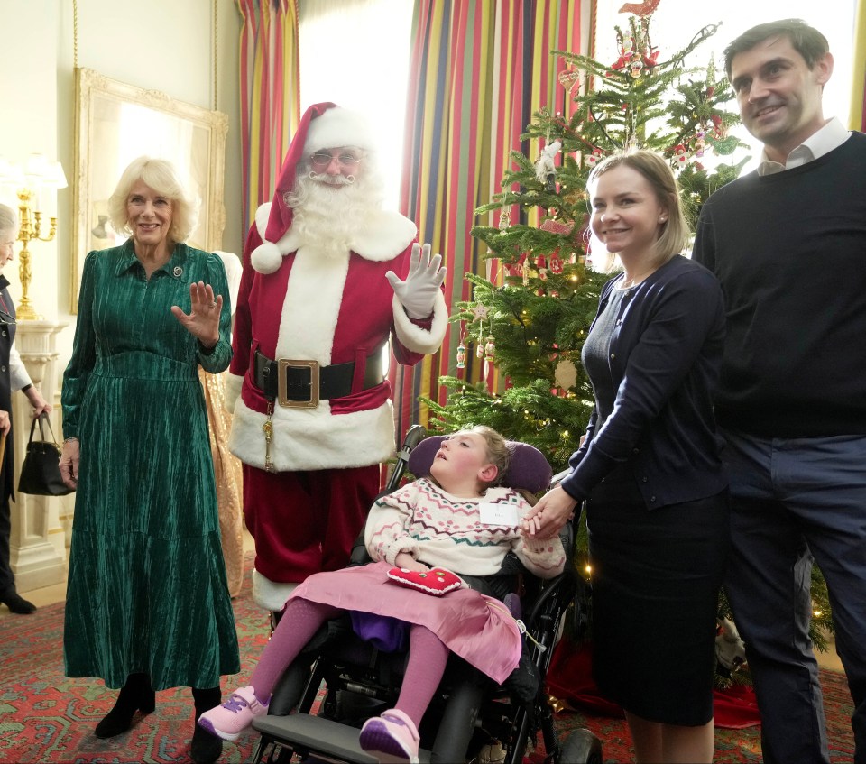 The Queen and Father Christmas delight guests at Clarence House