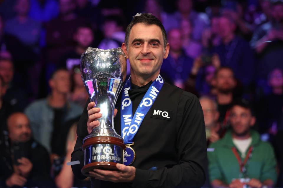 YORK, ENGLAND - DECEMBER 03: Ronnie O'Sullivan of England poses for a photo with the MrQ UK Snooker Championship 2023 trophy following victory against Ding Junhui of China in their Final match on Day Nine of the MrQ UK Snooker Championship 2023 at York Barbican on December 03, 2023 in York, England. (Photo by George Wood/Getty Images)