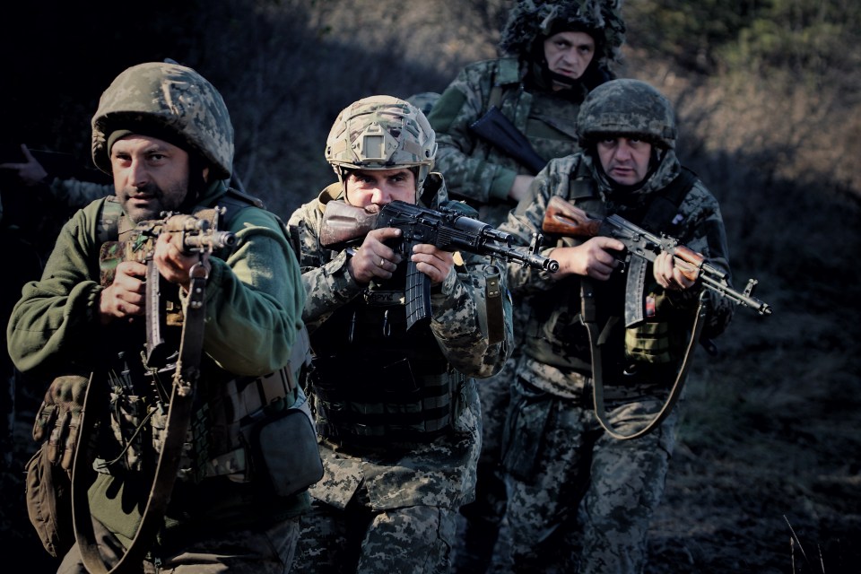 DONETSK OBLAST, UKRAINE - NOVEMBER 2: Armed Ukrainian soldiers from 108th Separate Mountain Assault Battalion walks along the road in the Lyman direction on November 2, 2023 in Donetsk Oblast, Ukraine. During the 2022 Russian invasion of Ukraine, following an intense battle for the city, Lyman was seized by Russian troops. On October 1, 2022, Ukrainian soldiers deoccupied Lyman. However, the city and its surroundings are still under fire. (Photo by Yan Dobronosov/Global Images Ukraine via Getty Images)