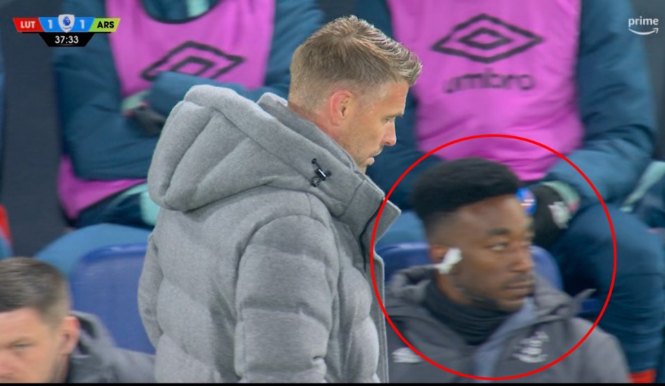 Fans were in disbelief as  they spotted him on Luton Town's bench last night