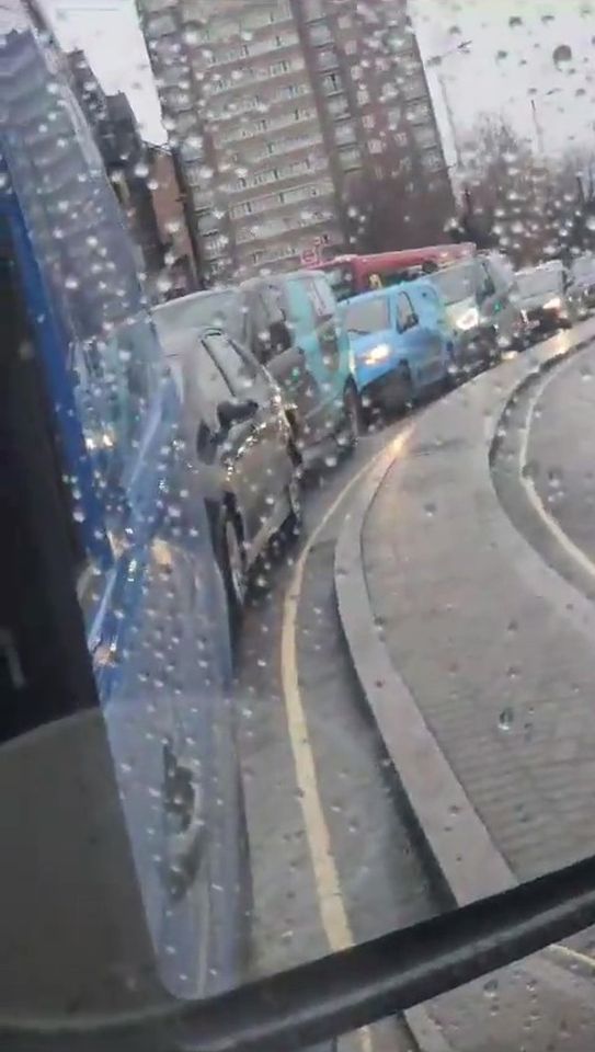 The motorist filmed the large queue forming behind him while the lights were red