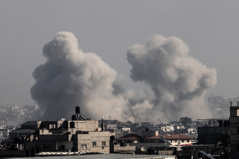 Smoke billows over Khan Yunis in the southern Gaza strip during Israeli bombardment on December 17, 2023, amid continuing battles between Israel and the Palestinian militant group Hamas. (Photo by Mahmud HAMS / AFP) (Photo by MAHMUD HAMS/AFP via Getty Images)