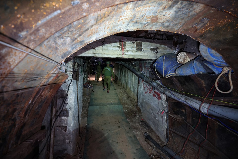 In this picture taken during a media tour organised by the Israeli military on December 15, 2023, soldiers visit a tunnel that Hamas reportedly used to attack Israel through the Erez border crossing on October 7. The Israeli army said on December 17, 2023 it had uncovered the biggest Hamas tunnel in the Gaza Strip so far, just a few hundred metres from the Erez border crossing. (Photo by JACK GUEZ / AFP) (Photo by JACK GUEZ/AFP via Getty Images)