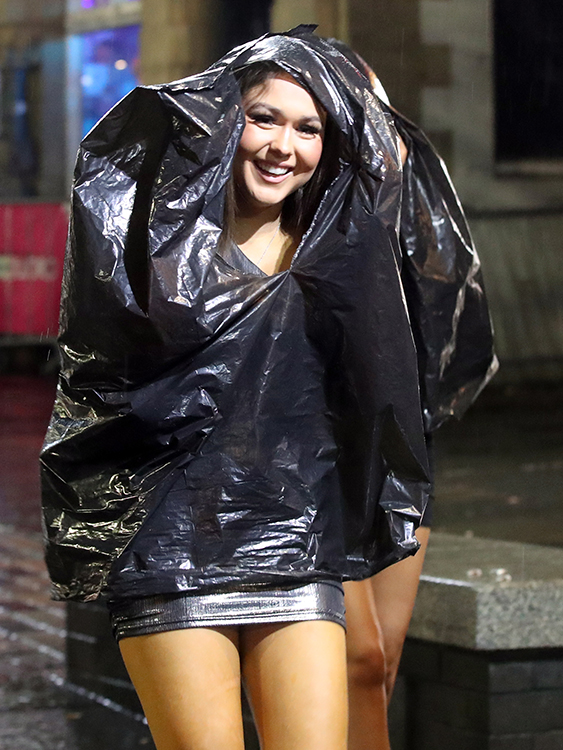 Some partygoers got creative and used black bin bags to shield themselves