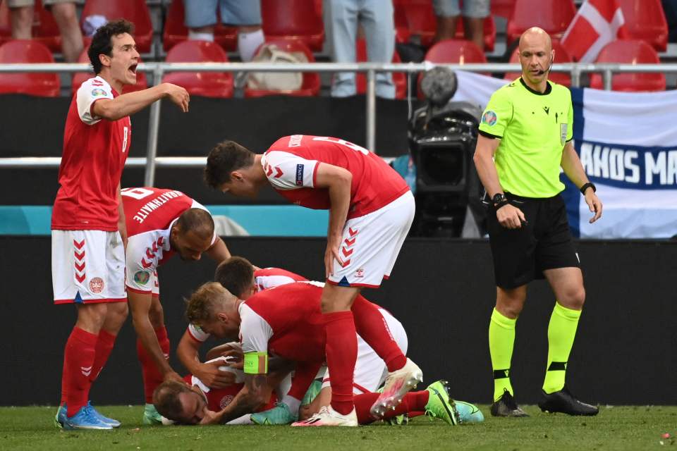 Denmark players quickly respond as Christian Eriksen suffers a cardiac arrest