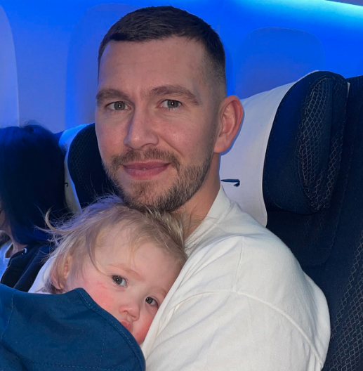 Charlotte's fiance Jake with his daughter Alba on the flight to the Maldives