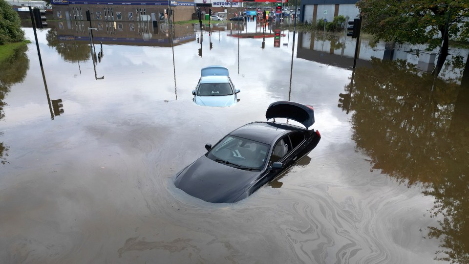 Flooded cars abandoned in the Pentagon area of Derby after the River Derwent burst its banks during Storm Babet