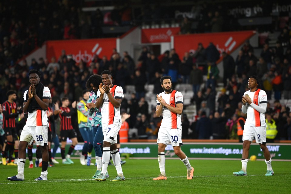 BOURNEMOUTH, ENGLAND â DECEMBER 16: Albert Sambi Lokonga, Chiedozie Ogbene, Andros Townsend and Gabriel Osho of Luton Town applaud fans after returning to the pitch after the match is suspended after Tom Lockyer of Luton Town (not pictured) collapsed during the Premier League match between AFC Bournemouth and Luton Town at Vitality Stadium on December [â¦]