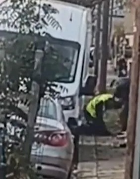 This is the shocking moment thugs kick and punch a parking warden in the face following a dispute over a parking ticket